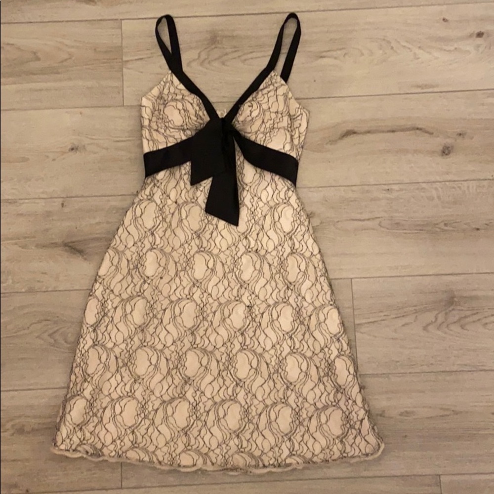 Beige and black padded lace dress